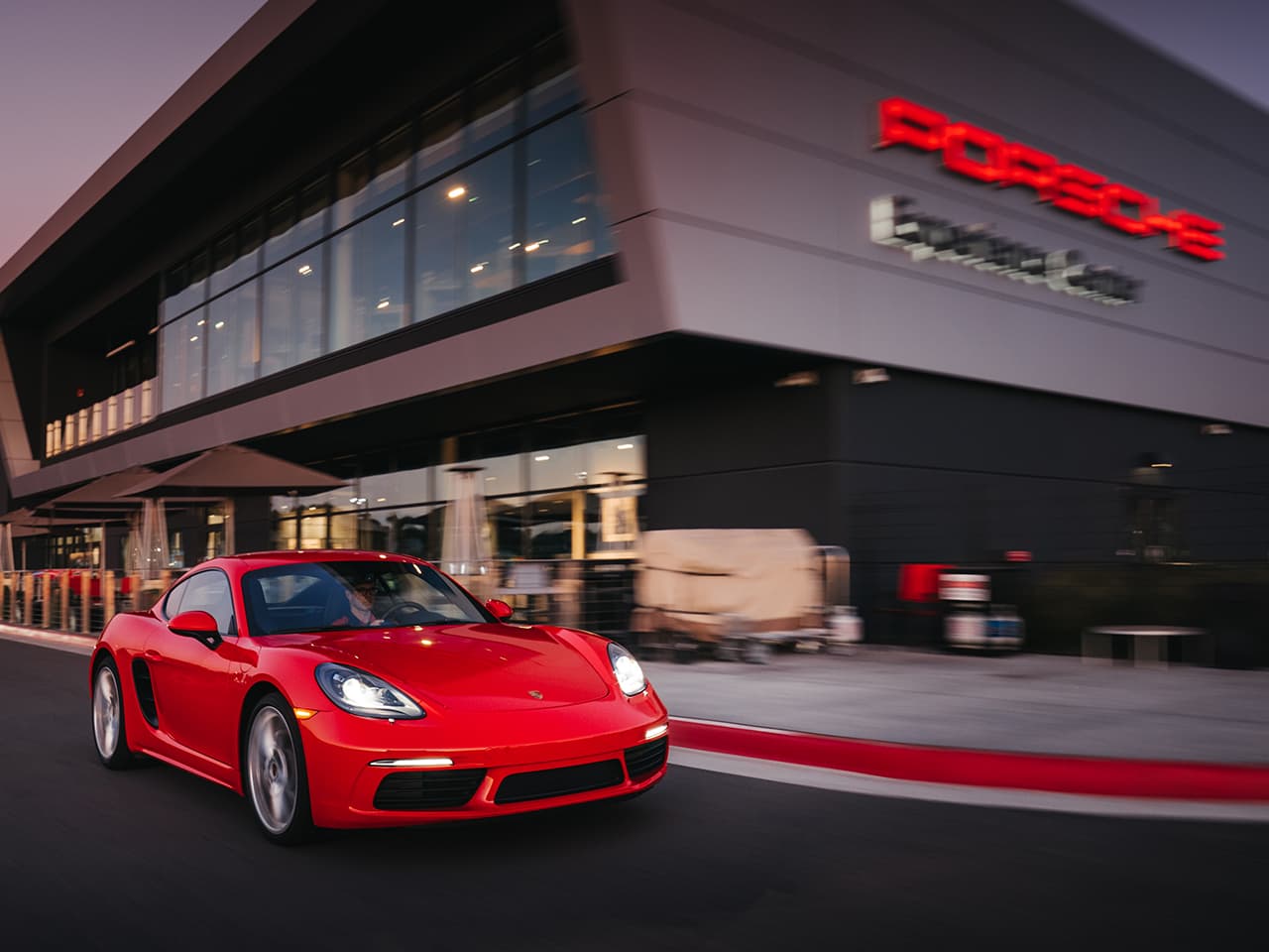 Porsche outside of a Porsche Experience Center