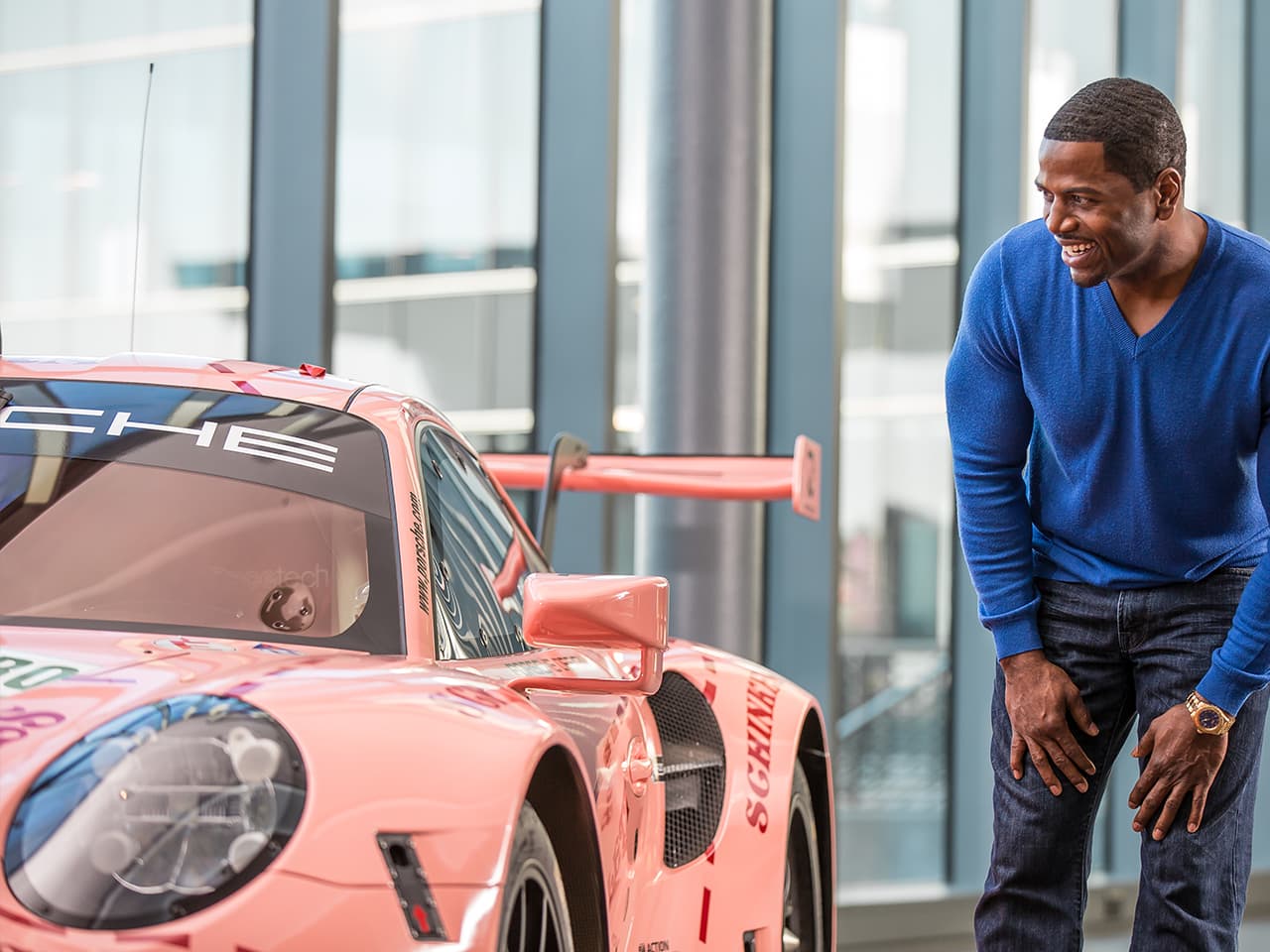Person looking at a Porsche Car