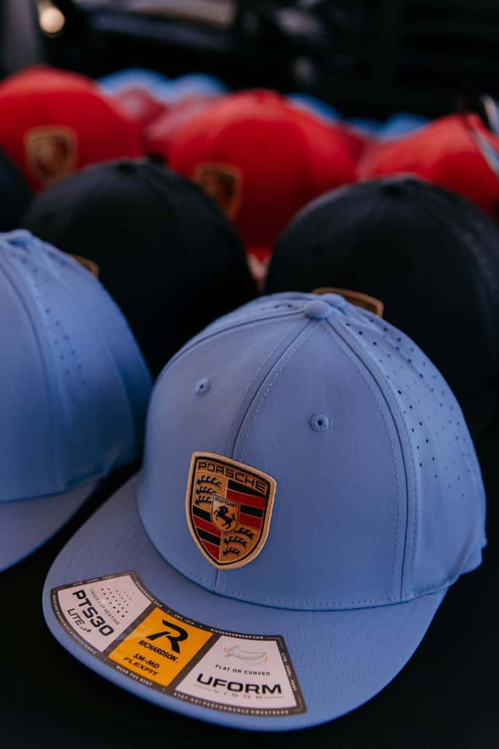 Porsche hats on table
