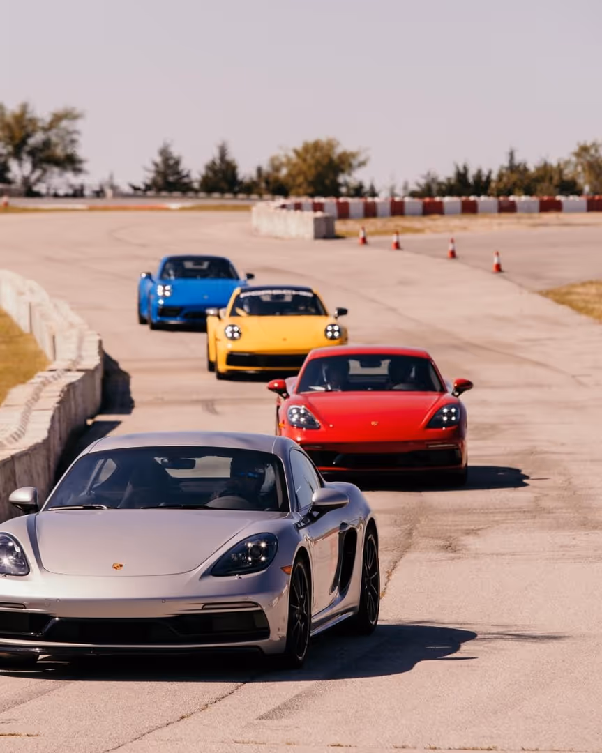 Fleet of Porsche 911s driving